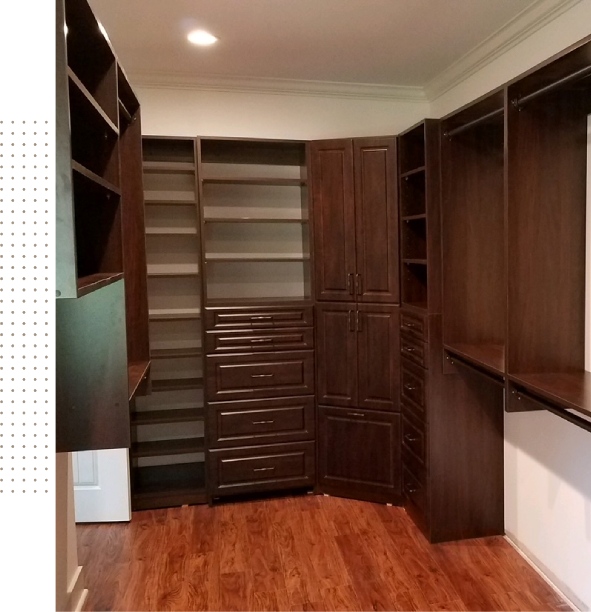 A room with a lot of wooden cabinets